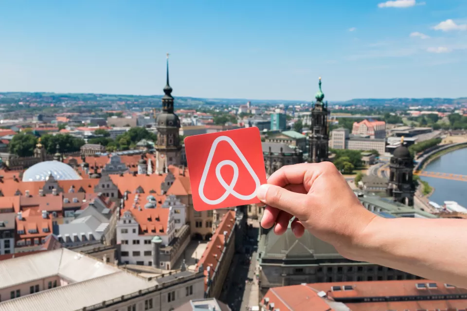 Airbnb logo over Dresden